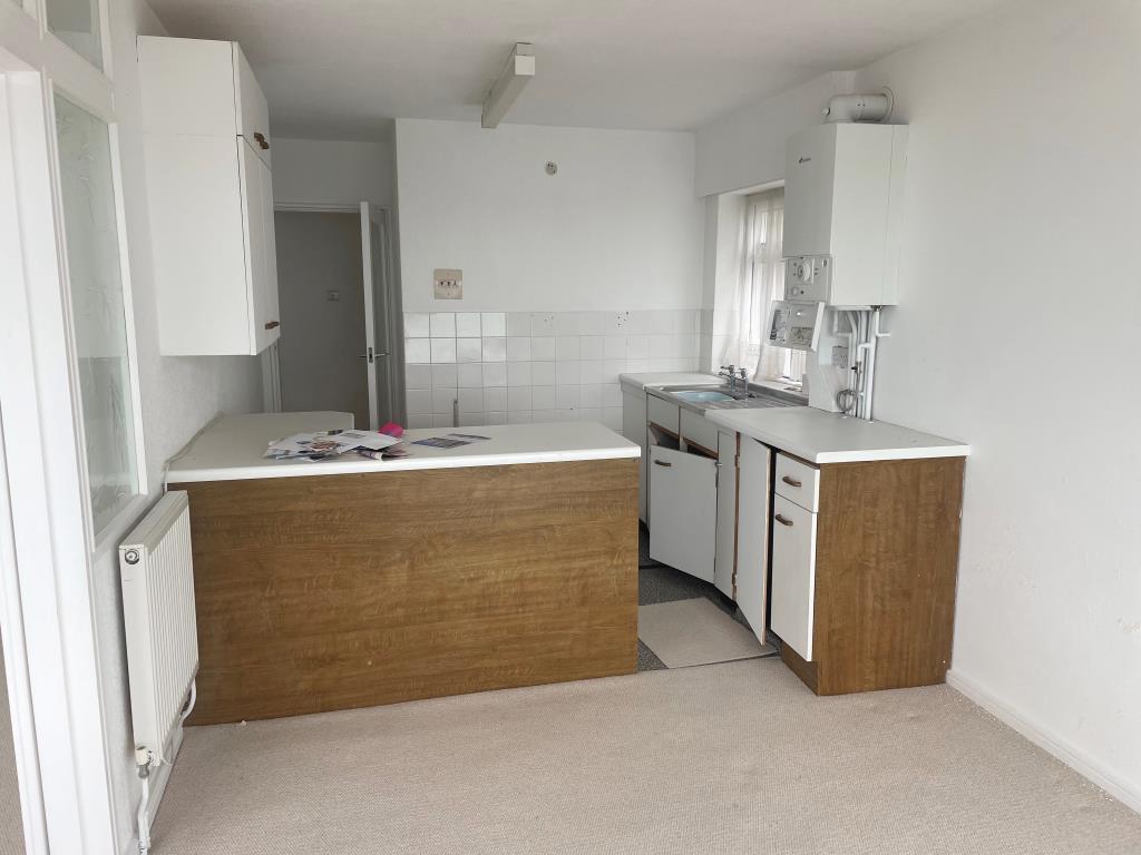 Lot: 12 - TWO-BEDROOM FLAT WITH SEA VIEWS - View of fitted kitchen from front window